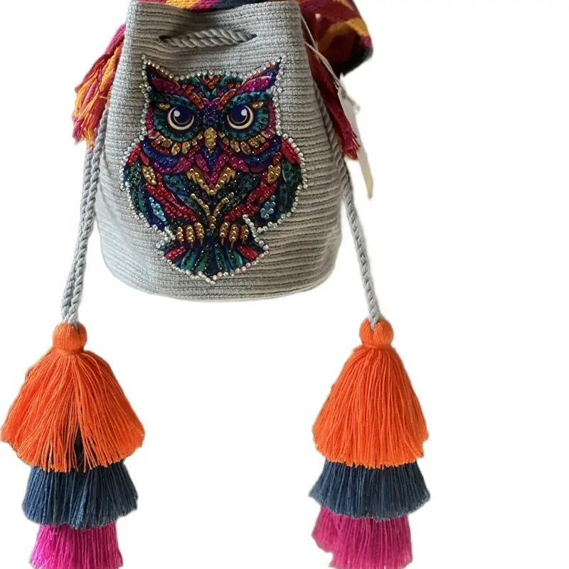 Originsl wayuu bag, hand-woven with two threads in spiral crochet technique. Owl front wall lamp decorated with rhinestones. Long and colorful belt to wear crossed.