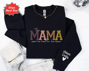 Personalized This Mama Wears Her Heart On Her Sleeve Sweatshirt, Personalized Mom With Kids Names Shirt, Motherhood Hoodie, Mother's Day Gifts