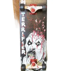 Terrifier Complete Skateboard with Blood Splatter Design and Red and Black Wheels