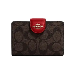 COACH Corner Zip Classic Monogram Coated Canvas and Leather Wristlet Clutch for Women in Red and Dark Brown