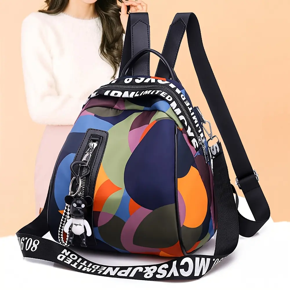 Cutecity women’s spring/summer new Oxford fabric all-over print backpack — casual, collegiate style, practical; top handle, can be worn crossbody; includes a small bear keychain; ample storage; suitable for adult vacations; color-block design.