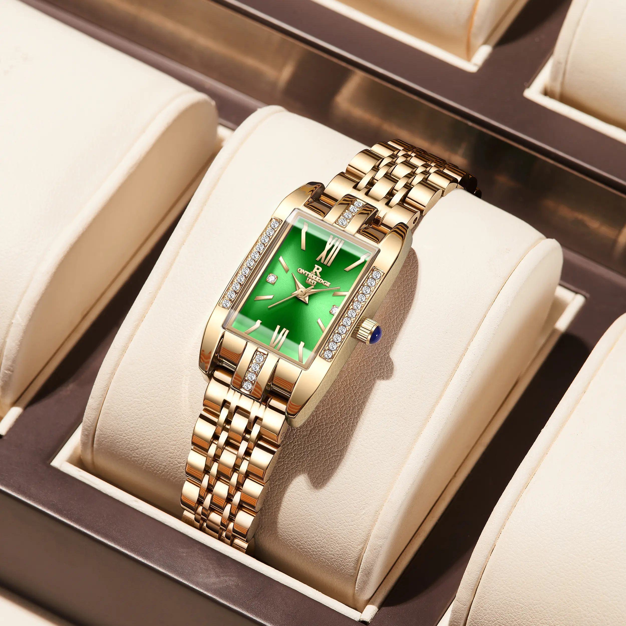 Rose gold case with green dial and steel strap