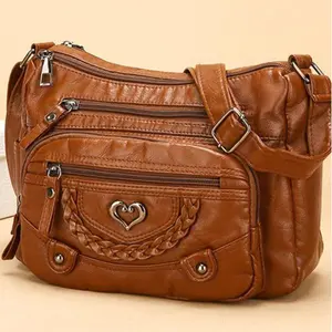 A stylish and soft genuine leather crossbodybag, designed for women, featuring multiplepockets, a heart-shaped pattern, and aspacious interior. It's fashionable, versatile,and perfect for everyday use.