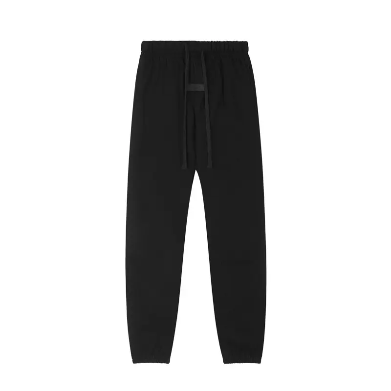 ESSENTIALS Fear of God Black Logo-Print Joggers — Minimalist, unisex streetwear-style joggers.