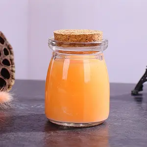 Set of 40 Glass Jars Featuring Cork Lids, Ideal for Storing Yogurt, Honey, Or Candies. These Glass Containers Come with Labels And Twine, Perfect for Weddings, Celebrations, And Gifting