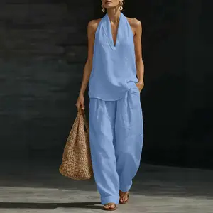 Women’s summer travel two-piece casual set: loose top paired with wide-leg pants with pockets; relaxed, laid-back style.