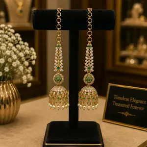 Elegant Gold-Toned Jhumka Earchain earrings with Ruby & Emerald Stones and Pearl Accents for Festive Wear Jewelry Accessory