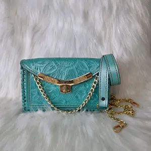 Ash Turquoise Embossed Leather Crossbody Bag with Gold Chain Strap and Floral Design