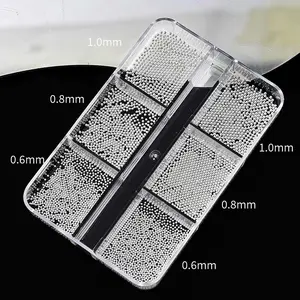 Mini nail art metal beads with 6 compartments, including mixed sizes in bright gold and silver, suitable for 3D nail art design, DIY nails, and nail decoration, durable and long-lasting, suitable for various nail styles