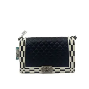 Pre-owned france Crossbody Bags Chanel black and white color blocked medium sized Le Boy chain bag