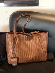 Niche fashion commuter shoulder tote bag, PU Tote Satchel, personalized woven craft wide shoulder strap design, fashionable and exquisite casual simple versatile multi-color optional, suitable for daily travel, shopping, etc.