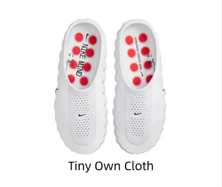 All-white perforated slip-on foam slides with chunky wavy sole & red anti-slip outsole studs