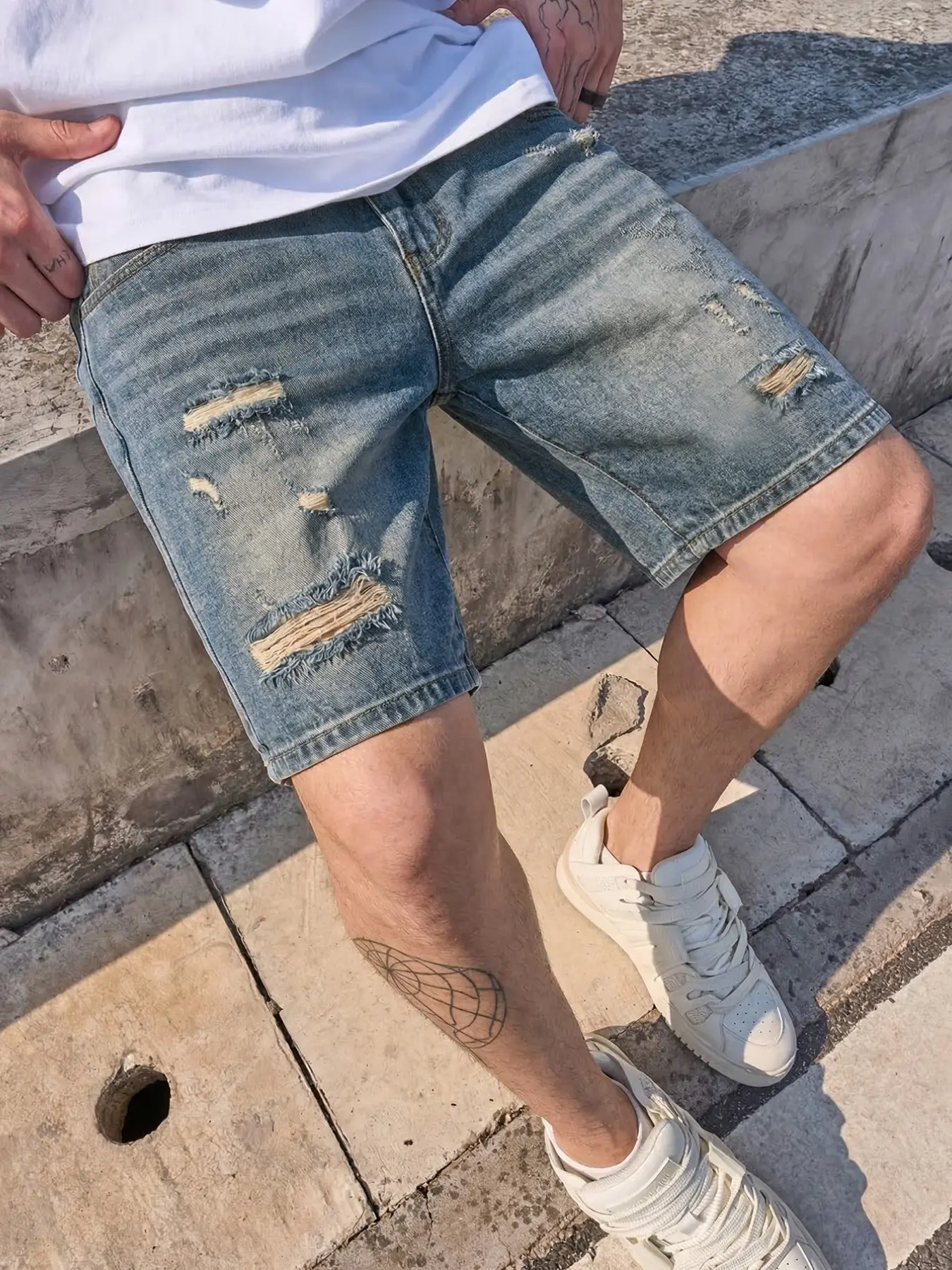Men's Classic vintage distressed streetwear washed blue straight-leg loose-fit plain denim Jean shorts, featuring full-length irregular frayed and ripped hole craftsmanship, suitable for daily individual and casual summer outfits Denim Look