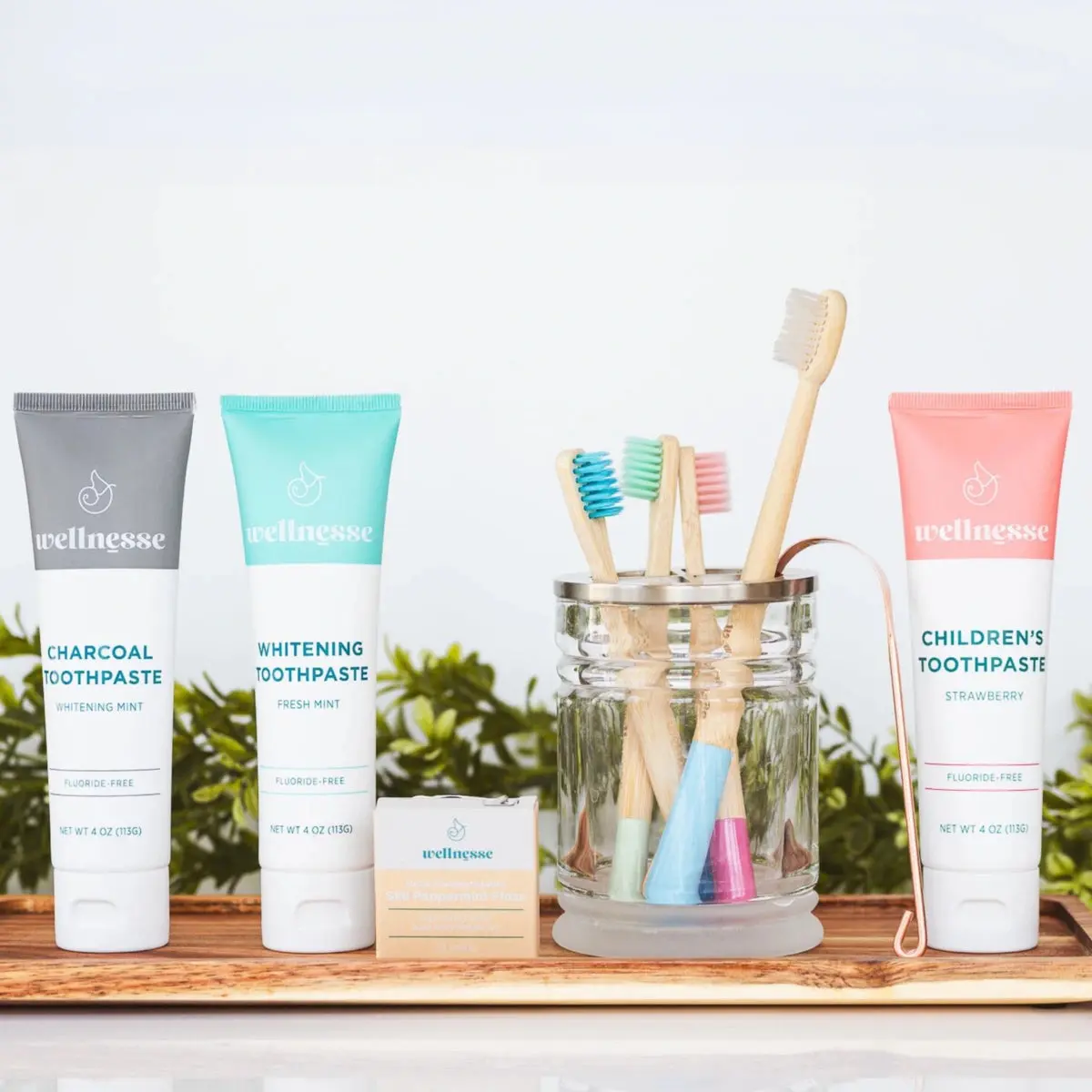 Wellnesse | Ultimate Family Bundle - Charcoal Whitening & Strawberry Toothpaste Gift Set for Oral Care with Floss & Toothbrushes