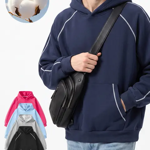 This unisex solid-color loose pullover hoodie features white contrast stitching and a front kangaroo pocket. It has a casual street style and offers multiple color options—an essential piece for the back-to-school season.