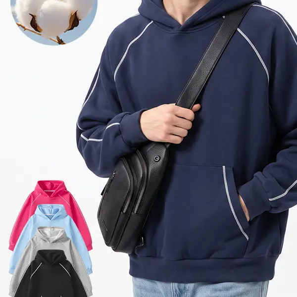 This unisex solid-color loose pullover hoodie features white contrast stitching and a front kangaroo pocket. It has a casual street style and offers multiple color options—an essential piece for the back-to-school season.