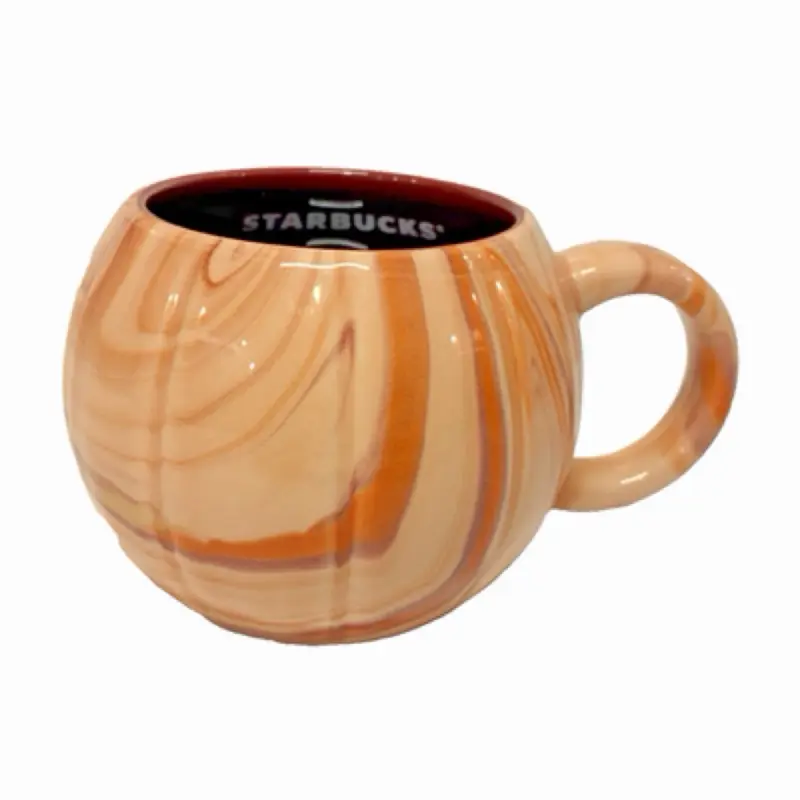 Starbucks Fall 2025 Limited Edition Marbled Pumpkin ceramic mug, featuring a swirling orange and cream marbled finish with a deep burgundy interior