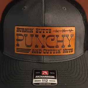 Punchy Leather Patch - Burnin' Butts and Cuttin' Nuts Baseball Cap Accessory Real Veg-Tan Leather 4.4 x 1.9 Inches Iron-On Instructions Included
