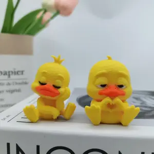 Two 3D-printed cute cartoon duck-shaped figurines, sitting in an adorable duck statue - classic yellow and orange printed plastic ducks, perfect for desktop decoration, home decoration, car accessories, Cute Animal Design, Home Decor Accessory