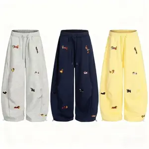 Men’s and women’s embroidered puppy loose round bucket sports pants, Y2K streetwear, loose retro running shoes — GARMENTARY