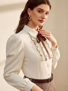 A women's camel-colored, mandarin-collar, cuffed, puffy-sleeved, lace-pleated, brown sat bow-tie pearl button vintage palace-style blouse, Button Up Blouse, suitable for spring, dating parties, afternoon tea and other occasions.