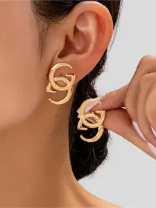 Gold double G letter earrings, minimalist luxury stud earrings. Elevate your style with this iconic double G earring. Sleek gold design adds a touch of luxury to any outfit. Elegant minimalist earrings