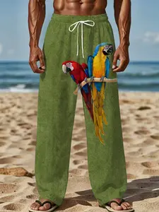 Green background parrot print drawstring casual tropical beach pants, men's loose long pants with a vacation style