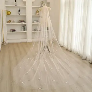 3D floral decorated veil, embellished with pearls, made of soft tulle fabric, a bridal veil.