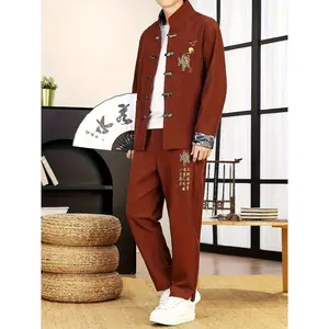 Men’s two-piece kung fu suit (Tang suit set): jacket with a Chinese‑style disc buckle and stand‑up collar, and spring/autumn printed trousers