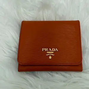 Pre-owned PRADA calfskin Mini Bags Vitello Move Tri Fold Compact Wallet Papaya