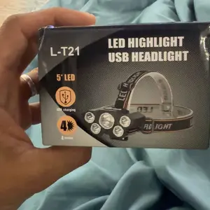 Two portable LED headlamps, flashlights that can be charged via USB, with waterproof function, adjustable headlamp design, suitable for outdoor camping, hiking, night fishing, and car maintenance work.