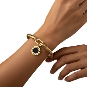 Gold-Tone Cable Bangle with Black Center Circle Charm for Women's Fashion Jewelry