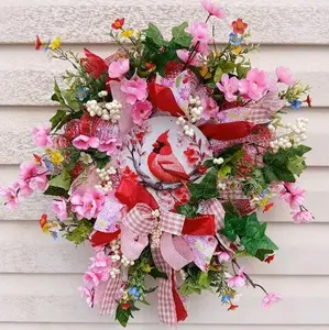 Cardinal Wreath with pink and colorful flowers, berries, ribbon and a bow