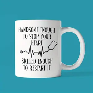 Ashton Books-n-Things Funny Medical Mug for Men - "Handsome Enough to Stop Your Heart Skilled Enough to Restart It" 11oz White Ceramic Coffee Cup with Stethoscope Design, Gift for Male Nurse ER Doctor EMT Paramedic (Christmas, Graduation, Independence Day