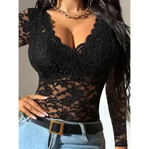A ladies' black lace chic blouse with netting and a short sleeve design, resembling a "ladie" style.