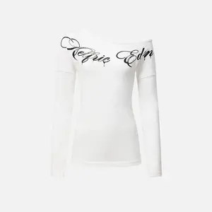 Aelfric Eden Off-The-Shoulder Rhinestone Script Long Sleeve Tee  Slim Fitted Silhouette Asymmetric Off-Shoulder Neckline Rhinestone Gothic Script Print High-Stretch Knit Fabric Y2K Edgy Streetwear Women Top