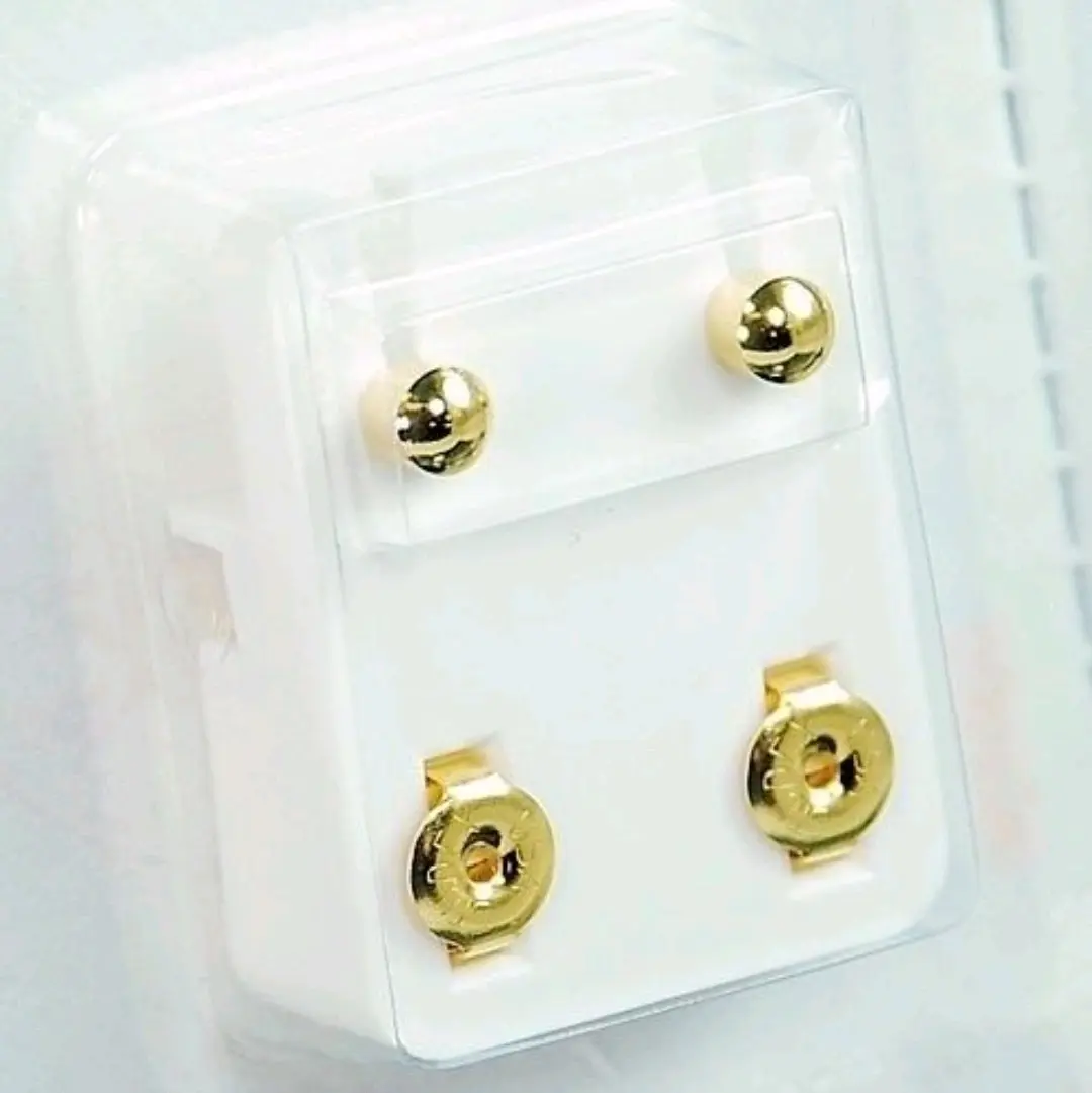 Golden Elegance: Simple & Stylish  Enhance your style with these classic gold-tone stud earrings! Perfect for any occasion—casual or formal.  Timeless Design: Sleek and polished for everyday elegance.  Secure Fit: Comfortable backs keep them snug all day