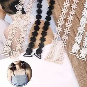 A Pair of Hollow Lace Floral Bras with Invisible Shoulder Straps, Suitable for Women, Featuring Lace Cross-Back And Halter Design.