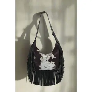 The Paula Faux Suede Cow Print Fringe Hobo Bag