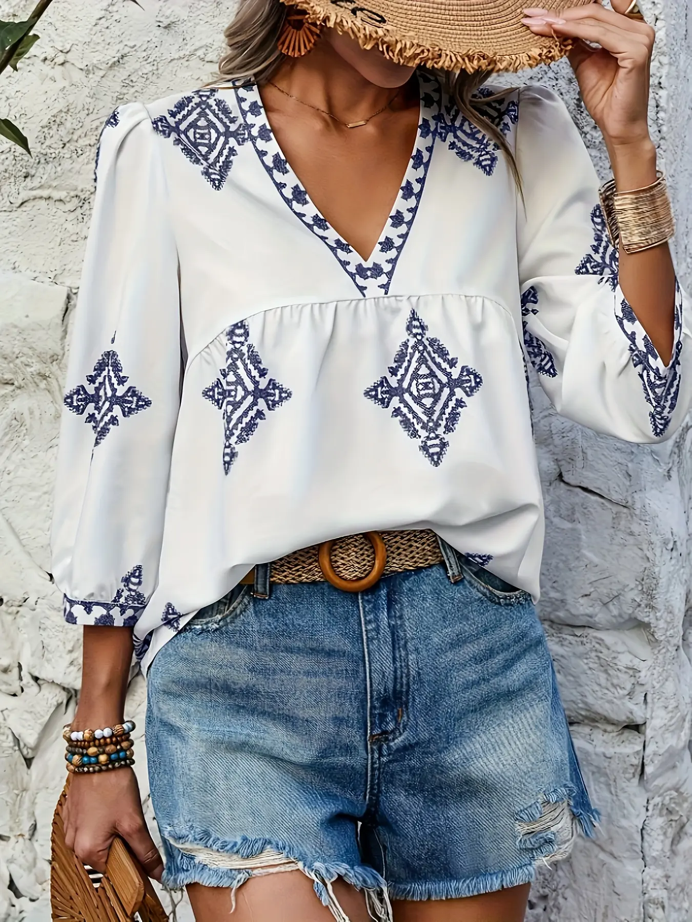 A white Woven geometric pattern V-neck short-sleeved blouse shirt for ladies, with a bohemian vacation style, suitable for all occasions.