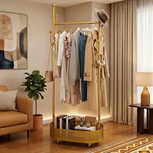 Mobile Clothes Rack with Bottom Storage Basket Space Saving Clothing Stand for Organized Storage in Gold Finish