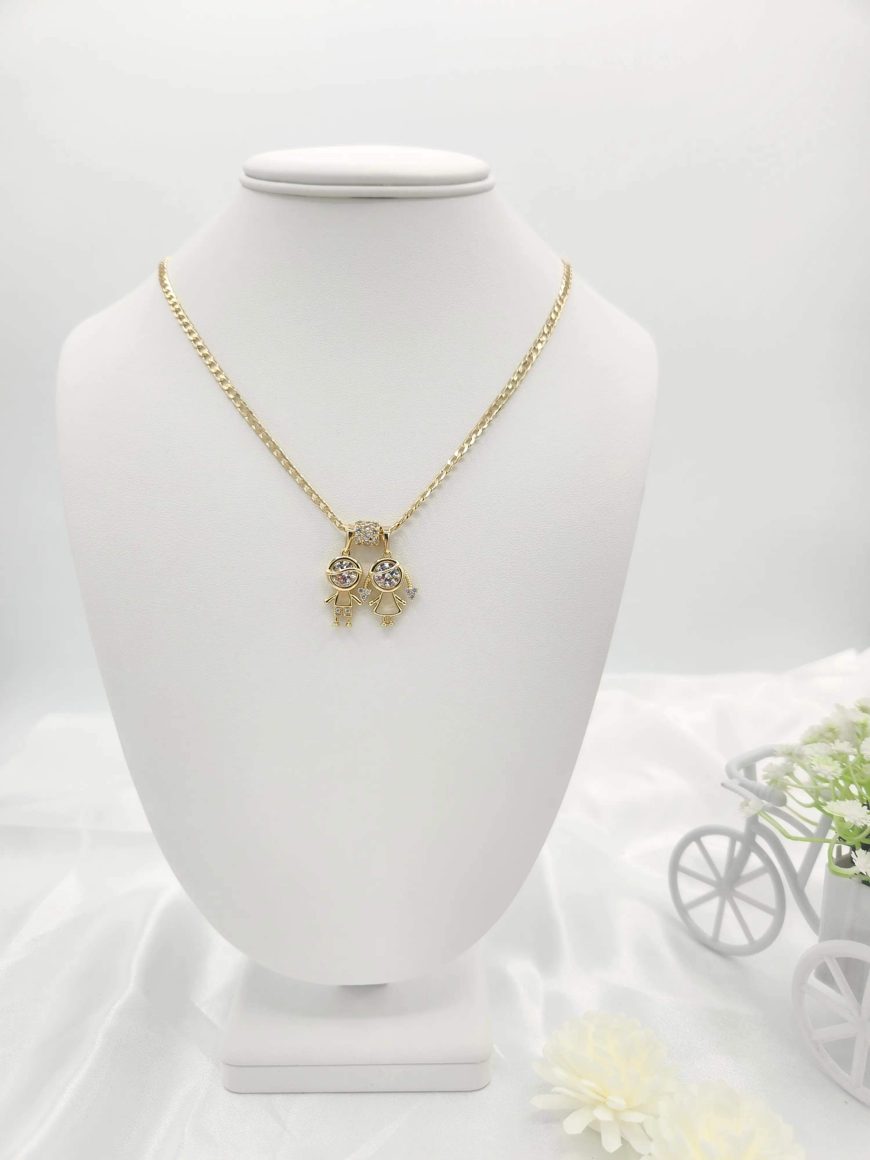 14k gold plated Cuban link chain with boy and girl charm.(20")   (44)