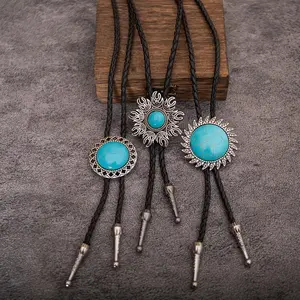 1 piece of a vintage bolo tie neck cord. Exhibiting a Western cowboy style, it's a leather bolo necklace adorned with natural blue turquoise and featuring a round pattern. It's a long-length necklace.