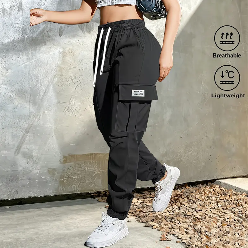 Women’s solid-color jogger cargo pants with a drawstring elastic waistband and multiple pockets, tapered leg design—suitable for everyday wear in all seasons, outdoor activities, running, and training.