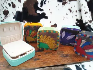 Travel jelwery box with a custom made leather top