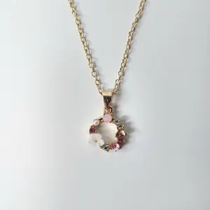 #570 Spring Wreath with White Flower, Golden Butterfly, Faux Pearls, Various Pink & Clear Rhinestones Necklace with 18 inch chain & 2 inch extender, Casual, Everyday Spring Jewelry, Alloy