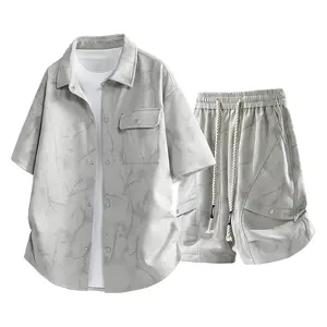 New men’s fashion set featuring a short-sleeve shirt and shorts; lightweight retro tie-dye loose-fit athletic trend set. Short-sleeve collared button-up top with pockets, paired with high-quality ruched deconstructed design shorts and a drawstring elastic