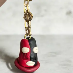 Elegua Llavero - Red and Black Design with Gold Chain and White Details
