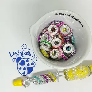 50 piece variety of metal rhinestone, mixed color and solid, silver, gold and gunmetal colors in 12 mm spacers.