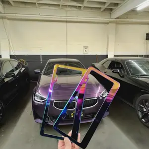 Set of two chameleon-colored license plate frames with hardware kit.